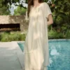 O1CN0123Zj5U22Xb5UXBWsE-2209697117130.jpg_q50.jpg_.webp ELLE莱赛尔酸奶油天丝连衣裙女2026夏新款荷叶边不规则a字长裙子