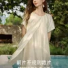 O1CN01UiwSRP22Xb5UD0WlO-2209697117130.jpg_q50.jpg_.webp ELLE莱赛尔酸奶油天丝连衣裙女2026夏新款荷叶边不规则a字长裙子