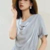 O1CN01lAMBuu2BTJvSeh937_94008339.jpg_q50.jpg_.webp 设计师款佐丹奴短袖裙子女假两件荡领压褶绑带收腰连衣裙18466509