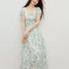 O1CN01nfceBV2DLeWfqoSqg_708558593.jpg_q50.jpg_.webp 周也代言红袖气质感连衣裙2026夏季新款女装度假风撞色串珠碎花裙
